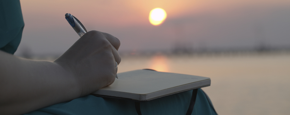 woman writing in journal